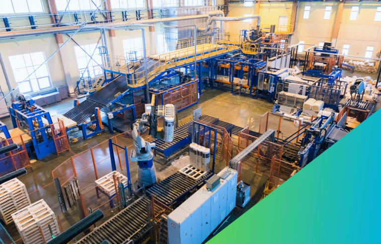 Overhead view of a brightly lit industrial factory floor featuring extensive automated conveyor systems, large industrial machinery, and a robotic arm handling products.