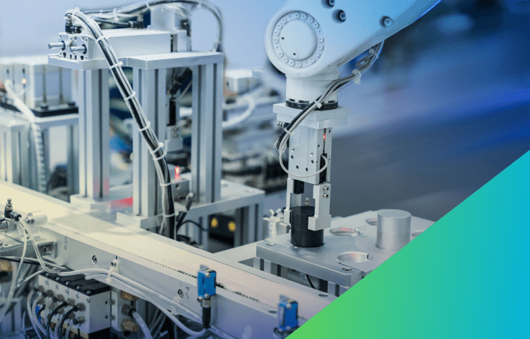 Close-up of a compact white industrial robotic arm performing a task over a small conveyor belt in manufacturing environment.